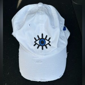 white hat with evil eye